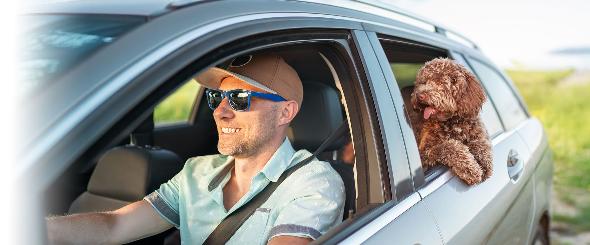 Man driving his new car